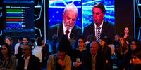 Ex-presidente Lula e o presidente Jair Bolsonaro durante o debate da TV Bandeirantes